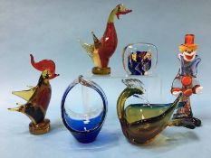 A Murano cased glass paperweight with fish, a Murano glass clown, three Murano glass animals and a