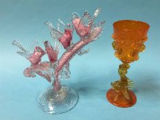 A Murano pink and white glass model of four birds sitting on the branch of a tree and a Murano