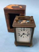 A small brass carriage clock and case
