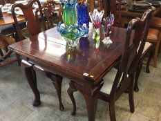 A mahogany drawer leaf table and four chairs