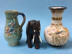 A Clarice Cliff water jug, a Satsuma vase and a carved elephant