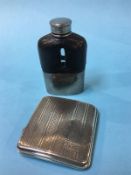 A silver cigarette case and a small hip flask