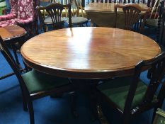 A Victorian mahogany oval table and a set of four mahogany chairs