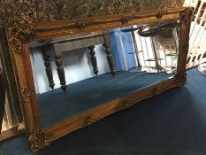 A large modern gilt rectangular mirror