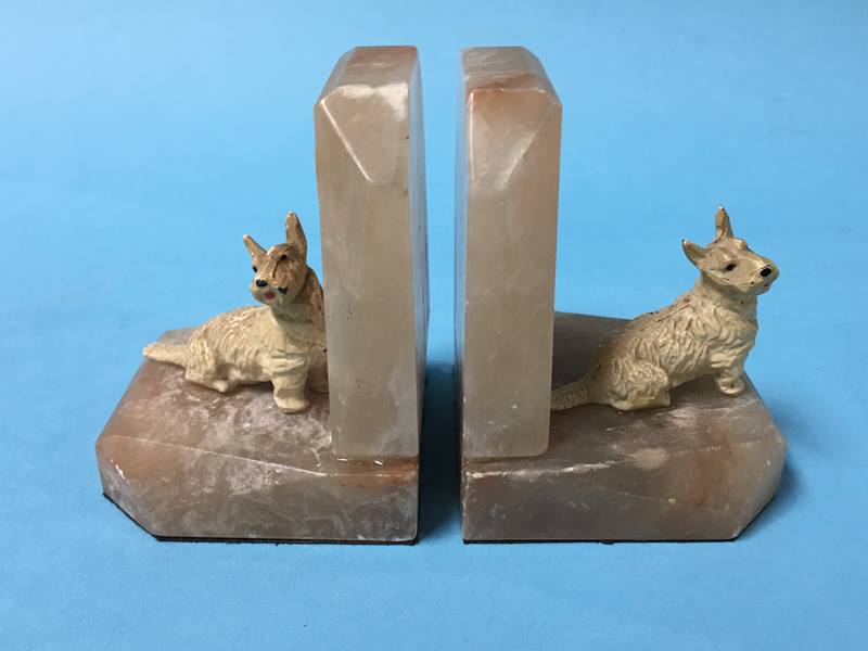 A pair of alabaster and cold cast mounted 'Scottie dog' book ends