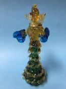 A Murano glass figure of a lady wearing a crinoline dress in blue, green and amber, signed G.