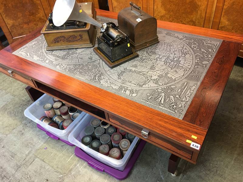 A large rosewood coffee table, inset with a map of the world