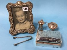 A silver photograph frame, a silver cigarette case etc.