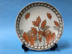 A Charlotte Rhead for Crown Ducal autumnal tube lined decorated plate, numbered 4921, 32cm diameter