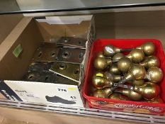 Box of brass door knobs and brass finger plates