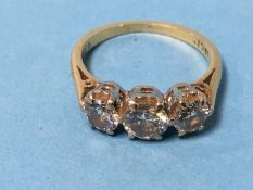 An 18ct gold diamond three stone (trilogy) ring