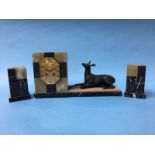 A French Art Deco marble and onyx clock garniture, the clock with 8 day movement and a deer lying to