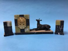 A French Art Deco marble and onyx clock garniture, the clock with 8 day movement and a deer lying to