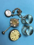 Two silver napkin rings, a silver pocket watch etc.