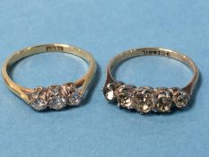 An 18ct gold, diamond three stone (trilogy) ring and another ring, total weight 3g