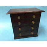 A miniature chest of two short and three long drawers, 32cm wide