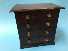 A miniature chest of two short and three long drawers, 32cm wide