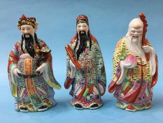 Three Chinese pottery figures; Fortune, Health and Longevity