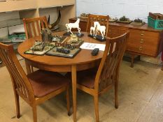 A teak dining room suite