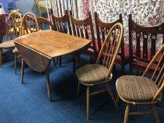 An Ercol Golden Dawn drop leaf table and four hoop back chairs