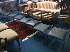 A set of eight metal work chairs