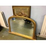 A gilt over mantle mirror and a tapestry