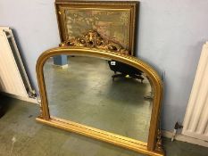 A gilt over mantle mirror and a tapestry