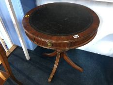 A reproduction mahogany drum table