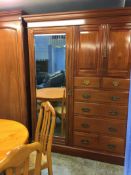 An Edwardian mahogany mirrored compactum wardrobe