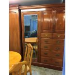 An Edwardian mahogany mirrored compactum wardrobe