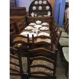 An oak dining room suite, with ten chairs