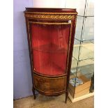 A Louis XV style glass front corner cabinet