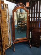 A reproduction mahogany cheval mirror