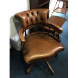 A Chesterfield brown leather office chair