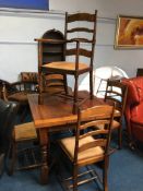 An oak drawer leaf table and five chairs