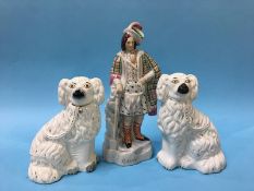 A Staffordshire figure of 'Bruce' and a pair of spaniels