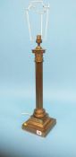 A metal ware Corinthian column table lamp