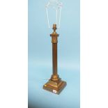 A metal ware Corinthian column table lamp