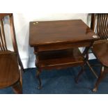 An Edwardian mahogany fold over two tier card table