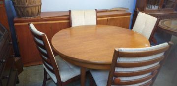 A teak dining room suite, comprising sideboard, circular table and four Harris Tweed upholstered