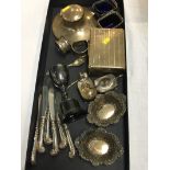 Assorted silver, to include a Capstan inkwell, various napkin rings etc.