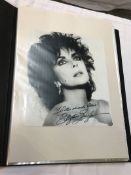 A collection of 55 autographs and signed photographs including; Elizabeth Taylor, Graham Hill,