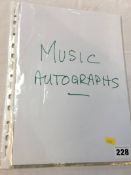 Music autographs; a collection of 11 individuals and groups including Queen (3 members), Crystal