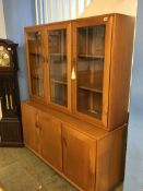 An Ercol Golden Dawn three door cabinet