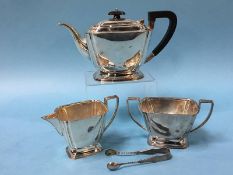 A silver three piece tea service, Atkin Brothers, Sheffield 1940, together with a pair of sugar