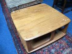 An Ercol 'Pandora' Golden Dawn square top coffee table