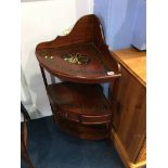 A reproduction mahogany corner wash stand