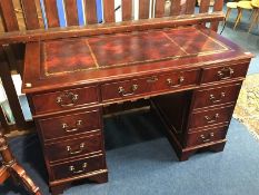 A reproduction mahogany pedestal desk