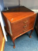 A mahogany three drawer music chest