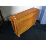 An Ercol Golden Dawn drop leaf table, 68cm wide, 45cm height